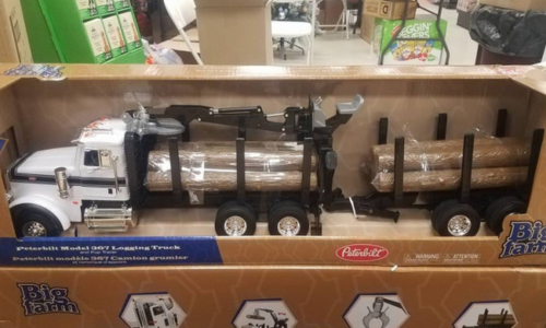 Toy rucks hauling logs on display inside of Southern States Cumberland Coop.